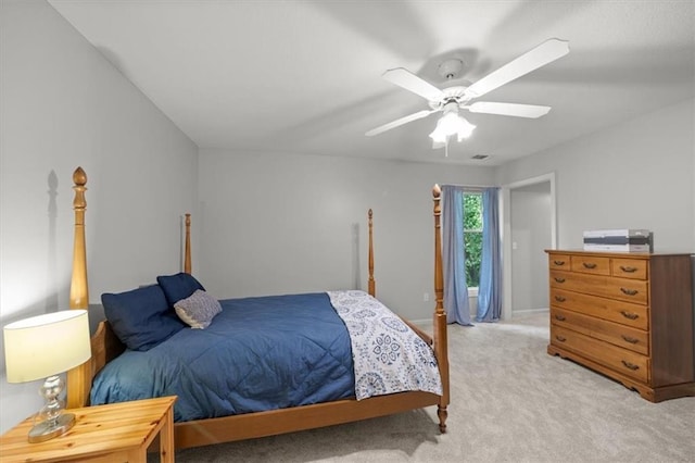 bedroom with ceiling fan, light colored carpet, baseboards, and visible vents