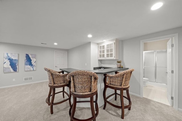 dining area with visible vents, recessed lighting, baseboards, and light carpet