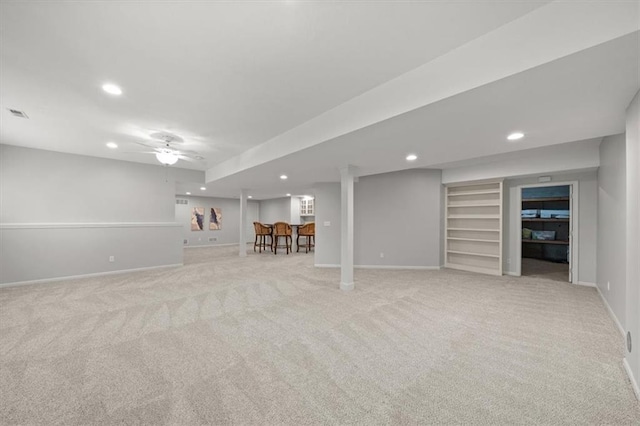 finished below grade area with recessed lighting, baseboards, and light carpet