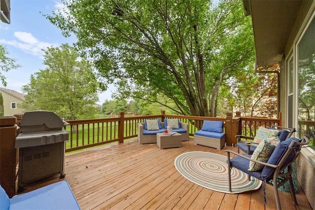 deck featuring an outdoor living space and area for grilling