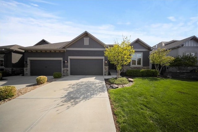 view of front of property featuring a garage, stone siding, a front yard, stucco siding, and concrete driveway