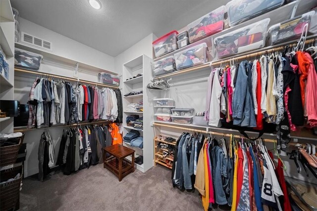 walk in closet with carpet flooring and visible vents