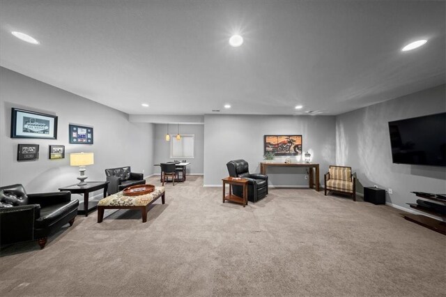 carpeted living room featuring recessed lighting and baseboards