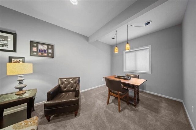 dining space with baseboards and carpet