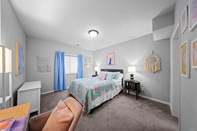 carpeted bedroom with baseboards
