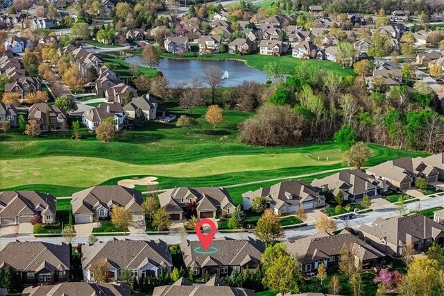 bird's eye view featuring a residential view, a water view, and golf course view