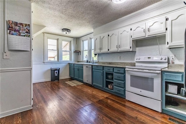 401 E Jackson St, Windsor, MO 65360 - kitchen with a textured ceiling, white electric range, blue cabinetry, open shelves, and dishwasher