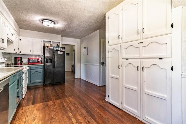 401 E Jackson St, Windsor, MO 65360 - kitchen featuring black fridge with ice dispenser, white cabinetry, and dark wood-style floors