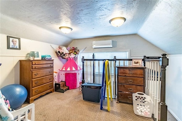 401 E Jackson St, Windsor, MO 65360 - carpeted bedroom featuring lofted ceiling, a textured ceiling, and a wall mounted air conditioner