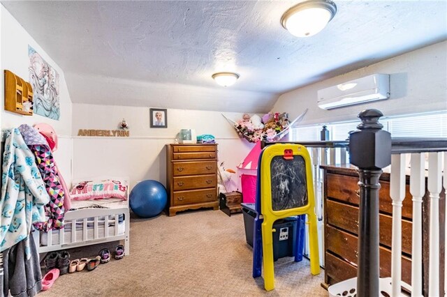 401 E Jackson St, Windsor, MO 65360 - bedroom with carpet, a textured ceiling, and a wall mounted air conditioner