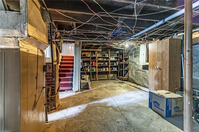 401 E Jackson St, Windsor, MO 65360 - unfinished below grade area featuring electric panel and stairs