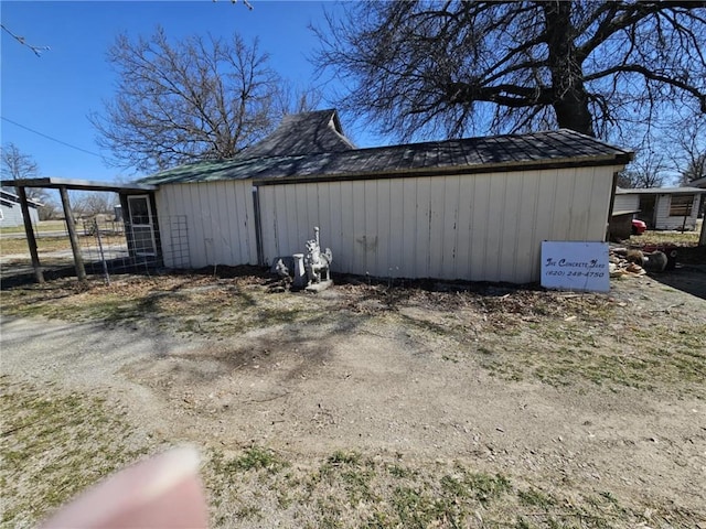 view of outdoor structure with fence