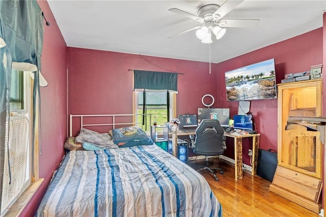 bedroom featuring ceiling fan and wood finished floors