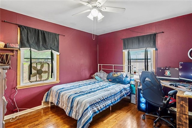 bedroom with ceiling fan and wood finished floors