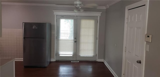 8508 Ruskin Way, Kansas City, MO 64134 - unfurnished dining area featuring dark wood-style floors, crown molding, and ceiling fan