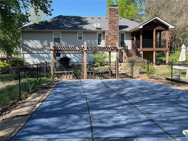 back of house with fence private yard, a pergola, a chimney, a shingled roof, and a gate