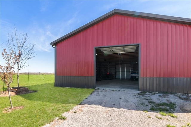 view of pole building with a yard