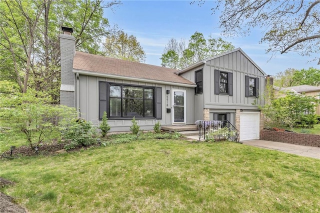 split level home featuring driveway, board and batten siding, a chimney, a front yard, and an attached garage