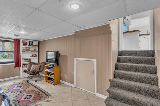 game room featuring baseboards, visible vents, light tile patterned flooring, and a paneled ceiling