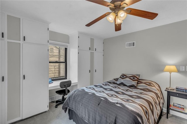 bedroom with light colored carpet, visible vents, and ceiling fan