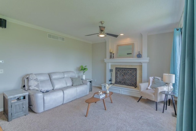 14108 Pine Valley Ct, Basehor, KS 66007 - living room with a ceiling fan, a tile fireplace, crown molding, carpet flooring, and baseboards