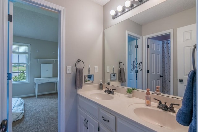14108 Pine Valley Ct, Basehor, KS 66007 - bathroom with double vanity and baseboards