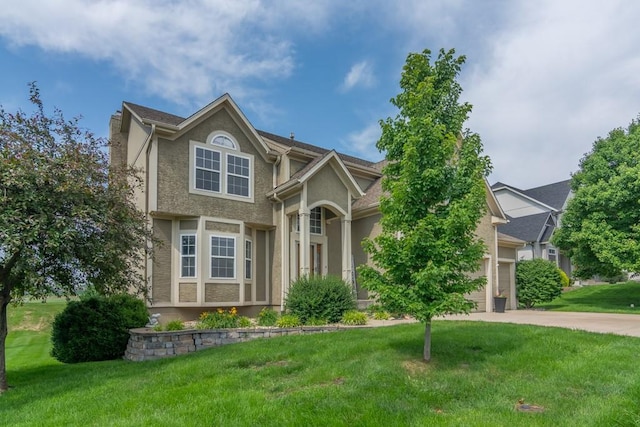 14108 Pine Valley Ct, Basehor, KS 66007 - traditional-style home featuring a front lawn, driveway, stucco siding, and a garage