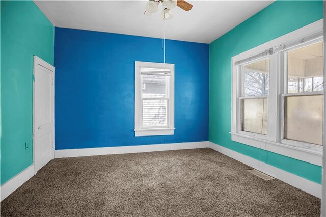707 E 8th St, Trenton, MO 64683 - spare room with carpet floors, visible vents, a ceiling fan, and baseboards