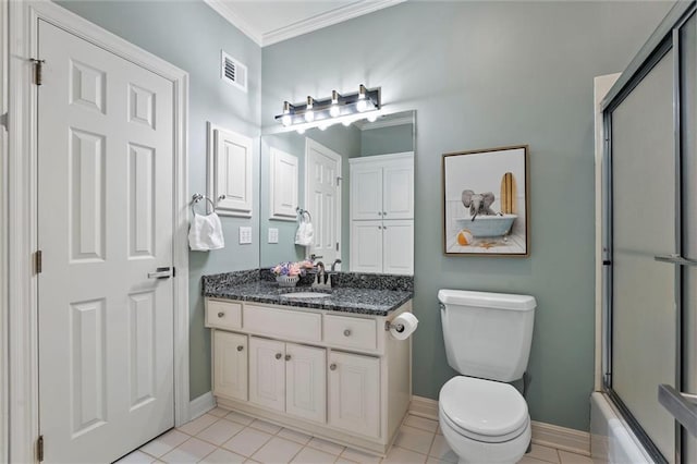 bathroom featuring visible vents, baseboards, crown molding, and toilet