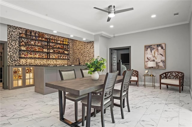 dining space featuring recessed lighting, marble finish floor, baseboards, and a community bar