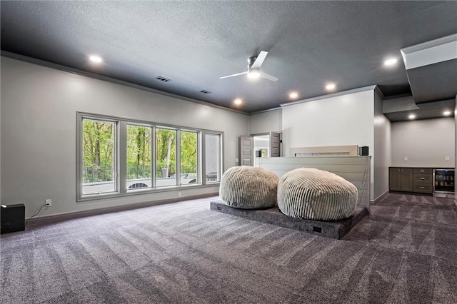 interior space featuring baseboards, carpet flooring, a ceiling fan, and wine cooler