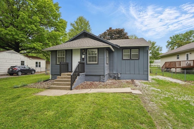 bungalow-style house with board and batten siding and a shingled roof