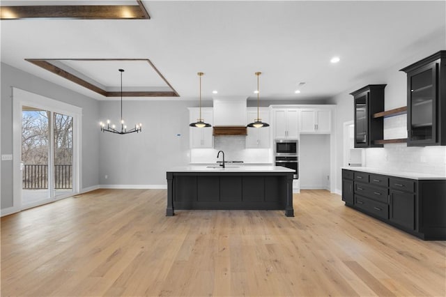 24919 W 145th St, Olathe, KS 66061 - kitchen with dark cabinets, light countertops, baseboards, decorative backsplash, and recessed lighting