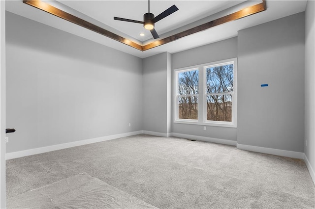 24919 W 145th St, Olathe, KS 66061 - carpeted spare room with ceiling fan, baseboards, a tray ceiling, and recessed lighting