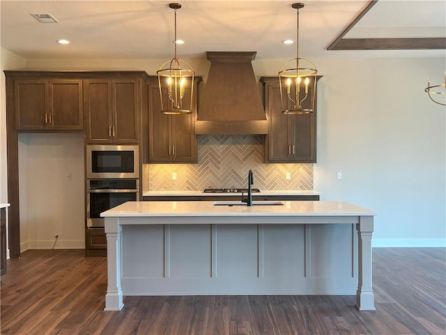 24919 W 145th St, Olathe, KS 66061 - kitchen with stainless steel oven, custom range hood, a sink, light countertops, and recessed lighting