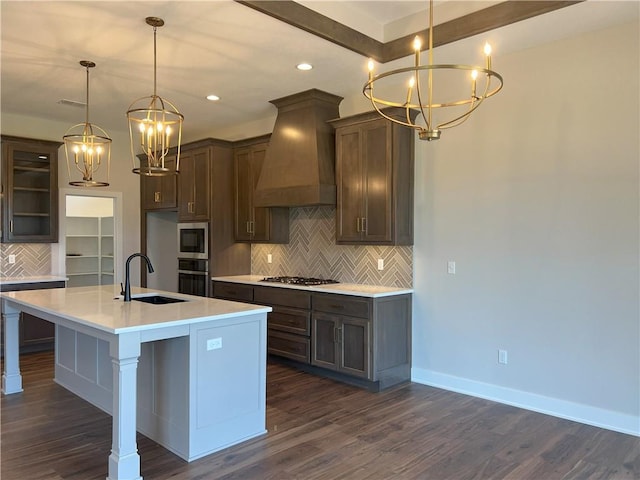 24919 W 145th St, Olathe, KS 66061 - kitchen with a chandelier, a sink, custom range hood, dark wood finished floors, and tasteful backsplash