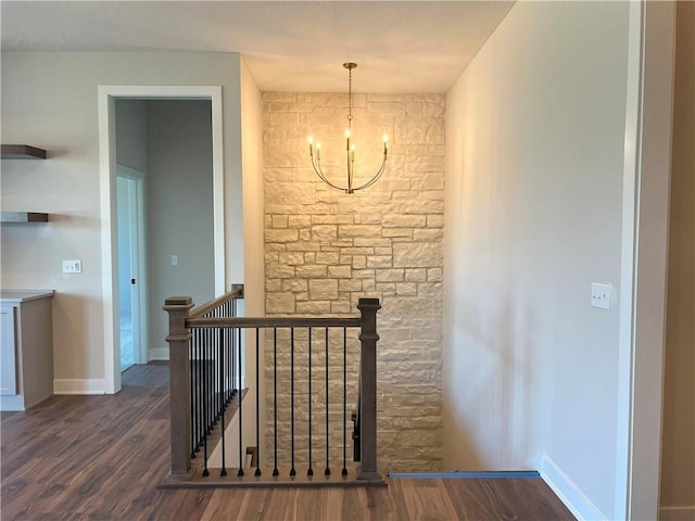 24919 W 145th St, Olathe, KS 66061 - staircase featuring a chandelier, wood finished floors, and baseboards
