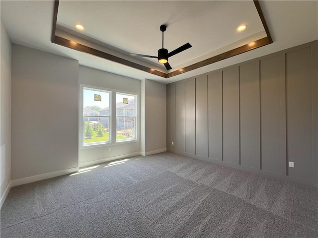 24919 W 145th St, Olathe, KS 66061 - spare room with a tray ceiling, a ceiling fan, baseboards, light carpet, and recessed lighting