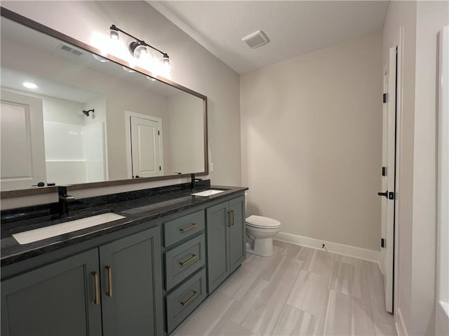 24919 W 145th St, Olathe, KS 66061 - bathroom with baseboards, toilet, double vanity, and a shower