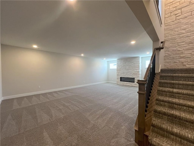 24919 W 145th St, Olathe, KS 66061 - below grade area featuring a fireplace, carpet, stairway, baseboards, and recessed lighting