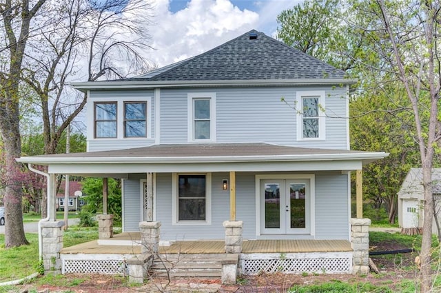 611 E 8th St, Wellsville, KS 66092 - farmhouse inspired home with a porch, a shingled roof, and french doors