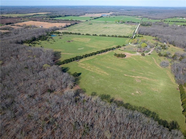 aerial view of property and surrounding area featuring rural landscape