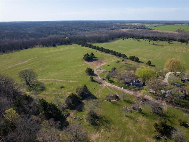 aerial view of property and surrounding area featuring rural landscape