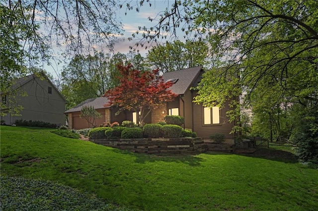 back of house featuring a lawn