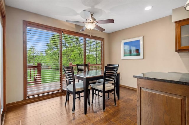 dining space featuring baseboards, recessed lighting, dark wood finished floors, and ceiling fan