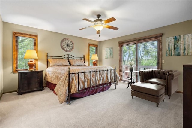 carpeted bedroom featuring baseboards and ceiling fan