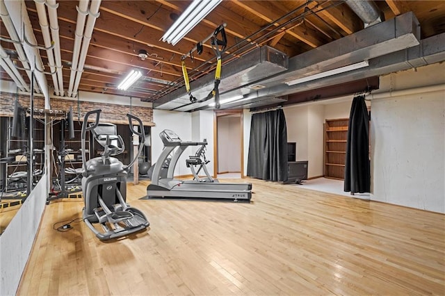 exercise room featuring wood-type flooring