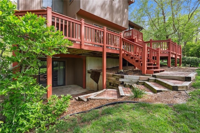 rear view of property with a wooden deck