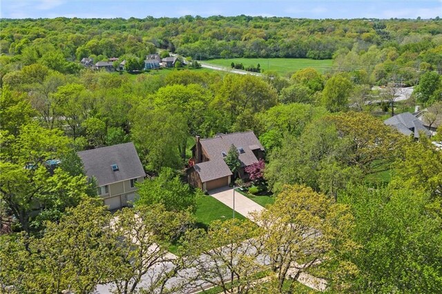drone / aerial view featuring a view of trees