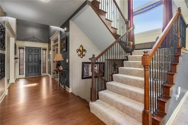 8912 NE 97th St, Kansas City, MO 64157 - entryway with baseboards, wood finished floors, and stairs